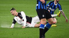 Juventus&#039; Portuguese forward Cristiano Ronaldo falls during the Italian Serie A football match Juventus vs Inter Milan, at the Juventus stadium in Turin on March 8, 2020. - The match is played behind closed doors due to the novel coronavirus outbreak