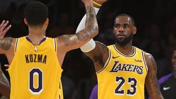 Oct 2, 2018; Los Angeles, CA, USA; Los Angeles Lakers forward LeBron James (23) and forward Kyle Kuzma (0) celebrate on the court in the first half of the game against the Denver Nuggets at Staples Center. Mandatory Credit: Jayne Kamin-Oncea-USA TODAY Spo