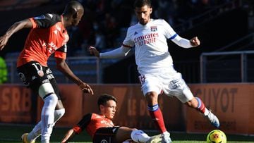 Lorient&#039;s French defender Houboulang Mendes (L) and Lorient&#039;s French midfielder Enzo Le Fee (C) fight for the ball with Lyon&#039;s French midfielder Houssem Aouar during the French L1 football match between Lorient (FCL) and Lyon (OL) on Septem