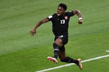 DOHA, QATAR - NOVEMBER 27: Alphonso Davies (19) of Canada celebrates after scoring the first goal during the Qatar 2022 World Cup Group F football match between Croatia and Canada at the Khalifa International Stadium in Doha on November 27, 2022. (Photo by Evrim Aydin/Anadolu Agency via Getty Images)