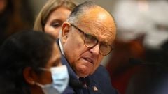 LANSING, MI - DECEMBER 02: U.S. President Donald Trump&#039;s personal attorney Rudy Giuliani listens to Detroit poll worker Jessi Jacobs during an appearance before the Michigan House Oversight Committee on December 2, 2020 in Lansing, Michigan. Guiliani