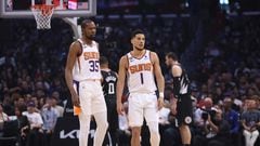 LOS ANGELES, CALIFORNIA - APRIL 22: Kevin Durant #35 and Devin Booker #1 of the Phoenix Suns react to the bench after a stop in play during the first quarter of Game Four of the Western Conference First Round Playoffs at Crypto.com Arena on April 22, 2023 in Los Angeles, California. NOTE TO USER: User expressly acknowledges and agrees that, by downloading and or using this photograph, User is consenting to the terms and conditions of the Getty Images License Agreement.   Harry How/Getty Images/AFP (Photo by Harry How / GETTY IMAGES NORTH AMERICA / Getty Images via AFP)
