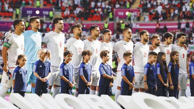 Why aren’t Iran players singing the national anthem before games at the World Cup?