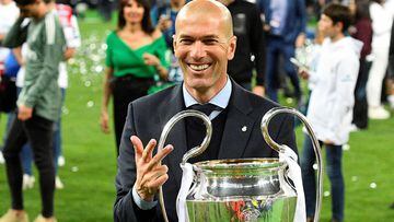 (FILES) In this file photo taken on May 26, 2018 Real Madrid&#039;s French coach Zinedine Zidane poses with the trophy after winning  the UEFA Champions League final football match between Liverpool and Real Madrid at the Olympic Stadium in Kiev, Ukraine.