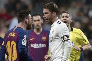 Lionel Messi and Sergio Ramos square off during a heated Clásico encounter.