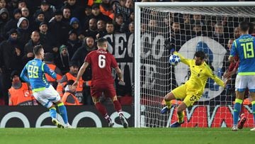 Liverpool&#039;s Brazilian goalkeeper Alisson Becker (2R) saves a shot from Napoli&#039;s Polish striker Arkadiusz Milik (L) during the UEFA Champions League group C football match between Liverpool and Napoli at Anfield stadium in Liverpool, north west E