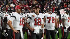 GLENDALE, ARIZONA - DECEMBER 25: Blaine Gabbert #11, Tom Brady #12 and Josh Wells #72 of the Tampa Bay Buccaneers stand on the sidelines prior to the start of the game against the Arizona Cardinals at State Farm Stadium on December 25, 2022 in Glendale, Arizona.   Norm Hall/Getty Images/AFP (Photo by Norm Hall / GETTY IMAGES NORTH AMERICA / Getty Images via AFP)