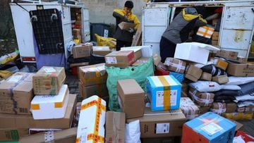 Delivery workers sort parcels at a makeshift logistics station near the Central Business District (CBD) during Singles&rsquo; Day shopping festival in Beijing, China November 11, 2021. 