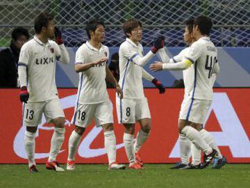 Kashima Antlers' Shoma Doi, centre, is congratulated by teammates after scoring a goal against Atletico Nacional during their match at the FIFA Club World Cup soccer tournament at Suita City Football Stadium in Suita, western Japan, Wednesday, Dec. 14, 20