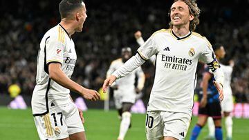 Real Madrid's Croatian midfielder #10 Luka Modric celebrates scoring his team first goal during the Spanish league football match between Real Madrid CF and Sevilla FC at the Santiago Bernabeu stadium in Madrid on February 25, 2024. (Photo by JAVIER SORIANO / AFP)