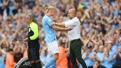 MANCHESTER, ENGLAND - AUGUST 27: Erling Haaland of Manchester City interacts with Pep Guardiola, Manager of Manchester City during the Premier League match between Manchester City and Crystal Palace at Etihad Stadium on August 27, 2022 in Manchester, England. (Photo by Shaun Botterill/Getty Images)