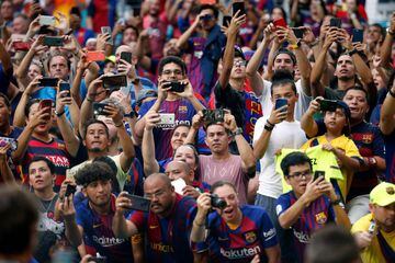 Fans hold up their cell phones during the International Champions Cup football match between FC Barcelona and SSC Napoli at Hard Rock Stadium in Miami, Florida, on August 7, 2019. 