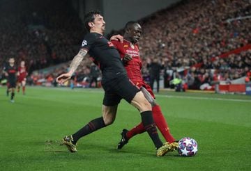 Liverpool's Sadio Mane in action with Atlético Madrid's Stefan Savic at Anfield.