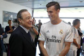 Bale with Florentino Perez in 2013, signing for Real Madrid.
