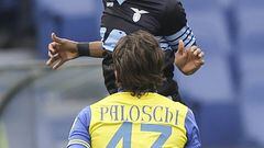 Lazio&#039;s Abdoulay Konko, top, heads the ball past Chievo&#039;s Alberto Paloschi.