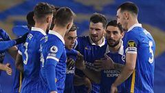 20 March 2021, United Kingdom, Brighton: Brighton and Hove Albion&#039;s Leandro Trossard celebrates scoring his side&#039;s first goal with teammates during the English Premier League soccer match between Brighton &amp; Hove Albion and Newcastle United a