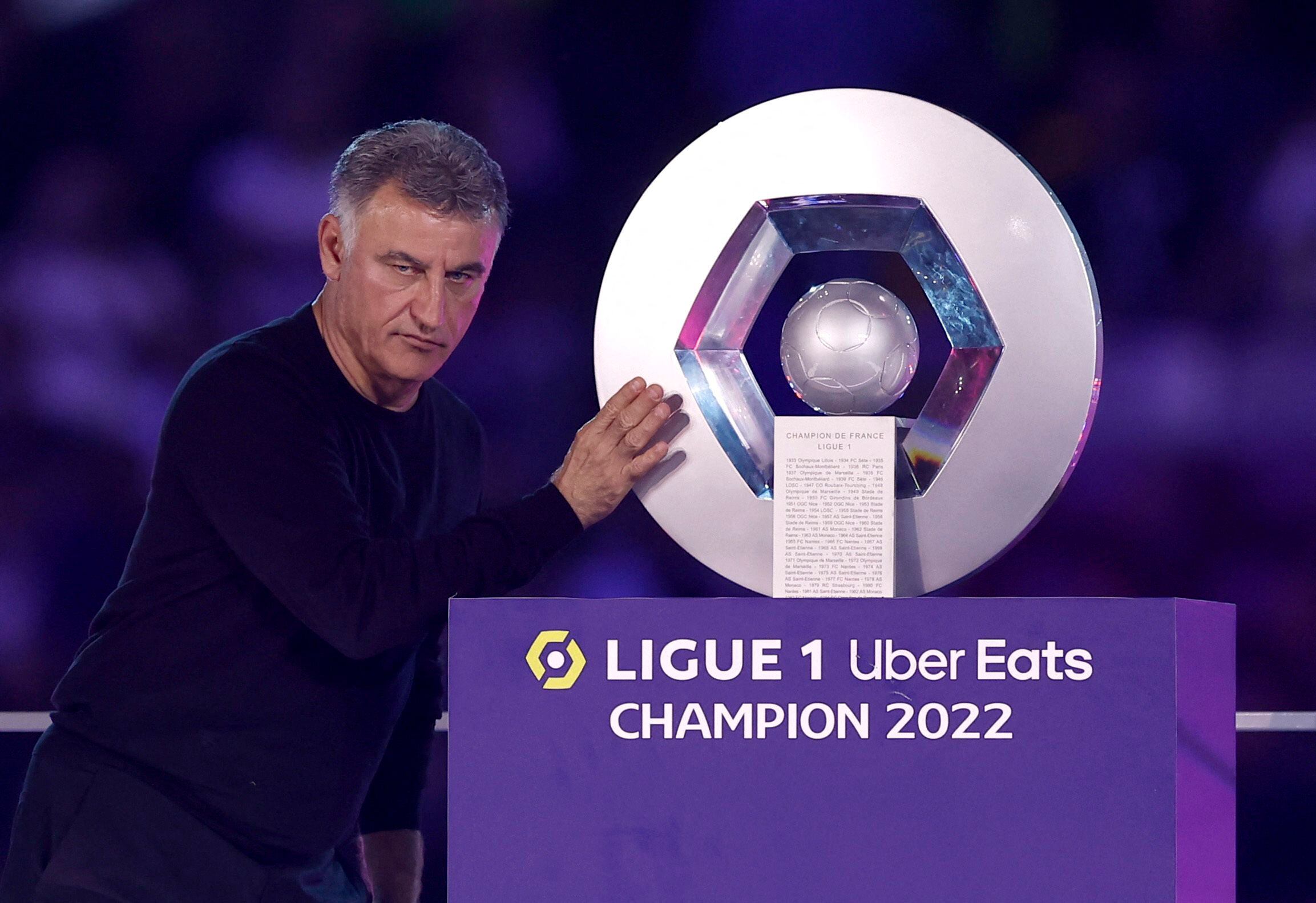 Soccer Football - Ligue 1 - Paris St Germain v Clermont - Parc de Princes, Paris, France - June 3, 2023  Paris St Germain coach Christophe Galtier poses with the trophy after winning the Ligue 1 REUTERS/Benoit Tessier