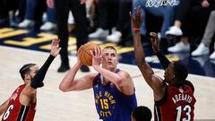 Jun 1, 2023; Denver, CO, USA; Denver Nuggets center Nikola Jokic (15) goes to the basket while defended by Miami Heat center Bam Adebayo (13) during the second quarter in game one of the 2023 NBA Finals at Ball Arena. Mandatory Credit: Isaiah J. Downing-USA TODAY Sports