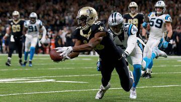 NEW ORLEANS, LA - JANUARY 07: Michael Thomas #13 of the New Orleans Saints catches a pass over James Bradberry #24 of the Carolina Panthers during the first half of the NFC Wild Card playoff game at the Mercedes-Benz Superdome on January 7, 2018 in New Or