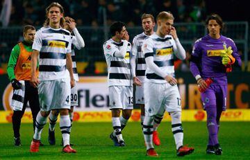 Borussia Moenchengladbach's players react at the end of the match