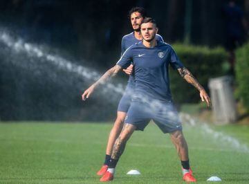 Inter Milan's Argentine forward Mauro Icardi stretches during a training session on the eve of the Champions League group stage football match Inter Milan vs Tottenham.