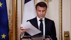 France's President Emmanuel Macron looks at notes as he addresses a joint press conference with the Prime Minister of the Netherlands following a meeting in Amsterdam on April 12, 2023. - Emmanuel Macron is on a two-day visit to the Netherlands, the first state visit by a French President for 23 years, to highlight a new dynamic between Paris and The Hague after Brexit, when the Netherlands lost its strongest ally in Europe. (Photo by Ludovic MARIN / AFP) (Photo by LUDOVIC MARIN/AFP via Getty Images)