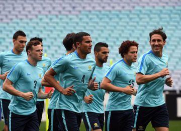 Australia's Tim Cahill jogs with teammates during a training session in Sydney on the eve of their match against Syria.