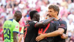 14 August 2022, Bavaria, Munich: Soccer: Bundesliga, Bayern Munich - VfL Wolfsburg, Matchday 2, Allianz Arena. Munich's Jamal Musiala (center) celebrates with Munich's Thomas Müller (right) and Munich's Sadio Mané after scoring the goal to make it 1:0. IMPORTANT NOTICE: In accordance with the regulations of the DFL Deutsche Fußball Liga and the DFB Deutscher Fußball-Bund, it is prohibited to use or have used photographs taken in the stadium and/or of the match in the form of sequence pictures and/or video-like photo series. Photo: Soeren Stache/dpa (Photo by Soeren Stache/picture alliance via Getty Images)