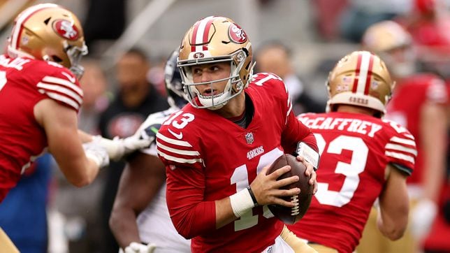 San Francisco 49ers wide receiver Brandon Aiyuk (11) runs against Seattle  Seahawks cornerback Tariq Woolen (27) during the first half of an NFL wild  card playoff football game in Santa Clara, Calif.