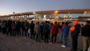 Venezuelan migrants stand in front of the US Border Patrol operations post across the Rio Bravo river, (or Rio Grande river, as it is called in the US), in Ciudad Juarez, state of Chihuahua, Mexico, on October 25, 2022. - Thousands of Venezuelans are trying to reach the United States in hope for a new life but earlier this month the US announced a new program granting legal entry to 24,000 people from the crisis-wracked country while deporting all those who cross through the border with Mexico illegally. The agreement between the US and Mexico would allow 24,000 Venezuelans to enter the United States if they can prove they have sponsorship, and only if they fly into the country. (Photo by HERIKA MARTINEZ / AFP) (Photo by HERIKA MARTINEZ/AFP via Getty Images)