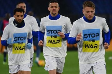 Lazio's Italian forward Ciro Immobile (R) and teammates wear a 'Stop the war' T-shirts referring to Russia's invasion of the Ukraine as they arrive to warm-up prior to the Italian Serie A football match between Lazio and Napoli at the Olympic stadium, in 
