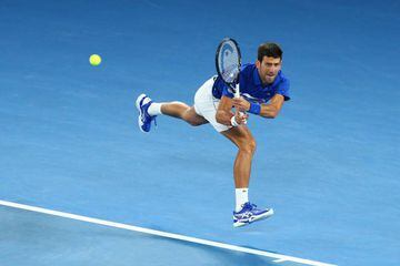 Novak Djokovic plays a backhand to Rafael Nadal in today's 2019 Australian Open final