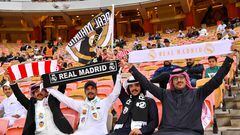 Real Madrid supporters wave scarves ahead of the Spanish Super Cup final between Real Madrid and Atletico Madrid on January 12, 2020, at the King Abdullah Sport City in the Saudi Arabian port city of Jeddah. (Photo by Giuseppe CACACE / AFP)