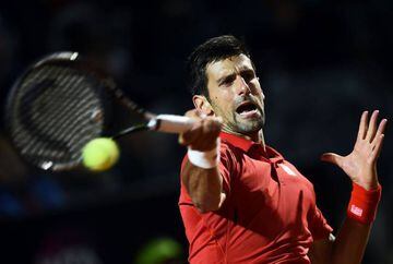 Djokovic returns a ball to Nishikori during the pair's semi-final clash in Rome.