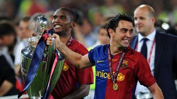 Samuel Eto'o with former Barcelona team mate Xavi and the Champions League trophy.