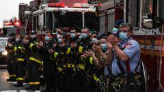 19 April 2020, US, New York: New York firemen clap for health care workers, who working on the fighting against Coronavirus (COVID-19) in front of the Langone Hospital, during the daily gratitude applause to health care workers. Photo: Miguel Juarez Lugo/