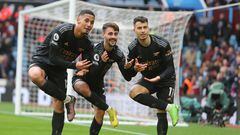 Arsenal's Brazilian midfielder Gabriel Martinelli (R) celebrates with Arsenal's Portuguese midfielder Fabio Vieira (C) and Arsenal's French defender William Saliba (L) after scoring their fourth goal during the English Premier League football match between Aston Villa and Arsenal at Villa Park in Birmingham, central England on February 18, 2023. - Arsenal won the game 4-2. (Photo by Geoff Caddick / AFP) / RESTRICTED TO EDITORIAL USE. No use with unauthorized audio, video, data, fixture lists, club/league logos or 'live' services. Online in-match use limited to 120 images. An additional 40 images may be used in extra time. No video emulation. Social media in-match use limited to 120 images. An additional 40 images may be used in extra time. No use in betting publications, games or single club/league/player publications. / 