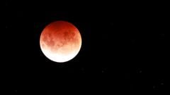Tonight an unusually large red moon will take over the night sky, thanks to a combination of lunar events occuring at the same point in the moon’s cycle.