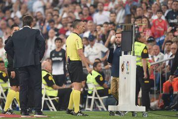 Referee Jaime Latre examines the VAR before awarding Real's 2nd goal during the La Liga match between Real Madrid CF and CD Leganes at Estadio Santiago Bernabeu on September 1, 2018 in Madrid