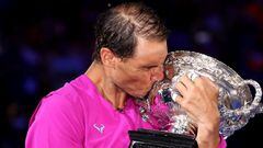 MELBOURNE, AUSTRALIA - JANUARY 30: Rafael Nadal of Spain kisses the Norman Brookes Challenge Cup as he celebrates victory in his Men’s Singles Final match against Daniil Medvedev of Russia during day 14 of the 2022 Australian Open at Melbourne Park on Jan