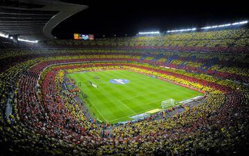 A Catalan flag is displayed by FC Barcelona fans prior to he La Liga match between FC Barcelona and Real Madrid CF at Camp Nou