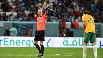 South African referee Victor Gomes (L) issues a yellow card to Australia's midfielder #22 Jackson Irvine during the Qatar 2022 World Cup Group D football match between France and Australia at the Al-Janoub Stadium in Al-Wakrah, south of Doha on November 22, 2022. (Photo by Chandan KHANNA / AFP)
