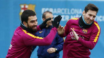 Messi and Turan at training.