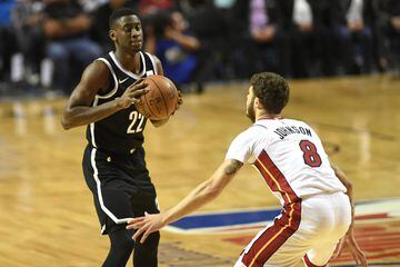 Brooklyn Nets' Caris LeVert (L) prepares to shoot the ball marked by Miami Heat's Tyler Johnson, during an NBA Global Games match at the Mexico City Arena, on December 9, 2017, in Mexico City. / AFP PHOTO / PEDRO PARDO
