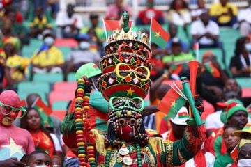 Burkina Faso football supprters are seen ahead of the opening ceremony of the Africa Cup of Nations (CAN) 2021 football tournament at Stade d'Olembé in Yaounde on January 9, 2022. (Photo by KENZO TRIBOUILLARD / AFP)