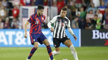 United States&#039; Ricardo Pepi, left, keeps the ball away from Costa Rica&#039;s Francisco Calvo during the second half of a World Cup qualifying soccer match Wednesday, Oct. 13, 2021, in Columbus, Ohio. The United States won 2-1. (AP Photo/Jay LaPrete)