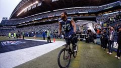 SEATTLE, WA - JANUARY 18:  Michael Bennett #72 of the Seattle Seahawks rides a police bike after the Seahawks 28-22 overtime victory against the Green Bay Packers during the 2015 NFC Championship game at CenturyLink Field on January 18, 2015 in Seattle, Washington.  (Photo by Otto Greule Jr/Getty Images)