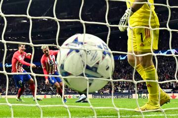 Atletico Madrid's French forward Antoine Griezmann scores during a UEFA Champions League group E game.