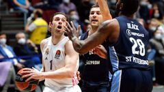 St. Petersburg (Russian Federation), 04/03/2021.- Fabien Causeur (L) of Madrid in action against Zenit players Billy Baron (C) and Tarik Black (R) during the Euroleague basketball match between BC Zenit St. Petersburg and Real Madrid in St. Petersburg, Ru