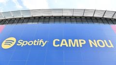 This photograph taken on July 1, 2022 shows the logo of Spotify Technology S.A on the banner at the entrance of the Camp Nou stadium in Barcelona. (Photo by Pau BARRENA / AFP)